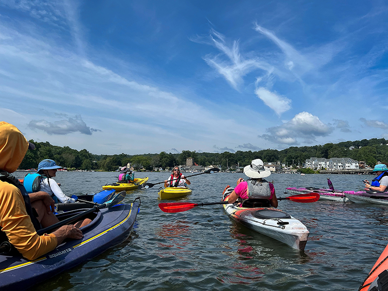 Donna Macalle-Holly speaks to a group of kayakers.